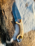 Bone handle with natural texture and steel pins visible