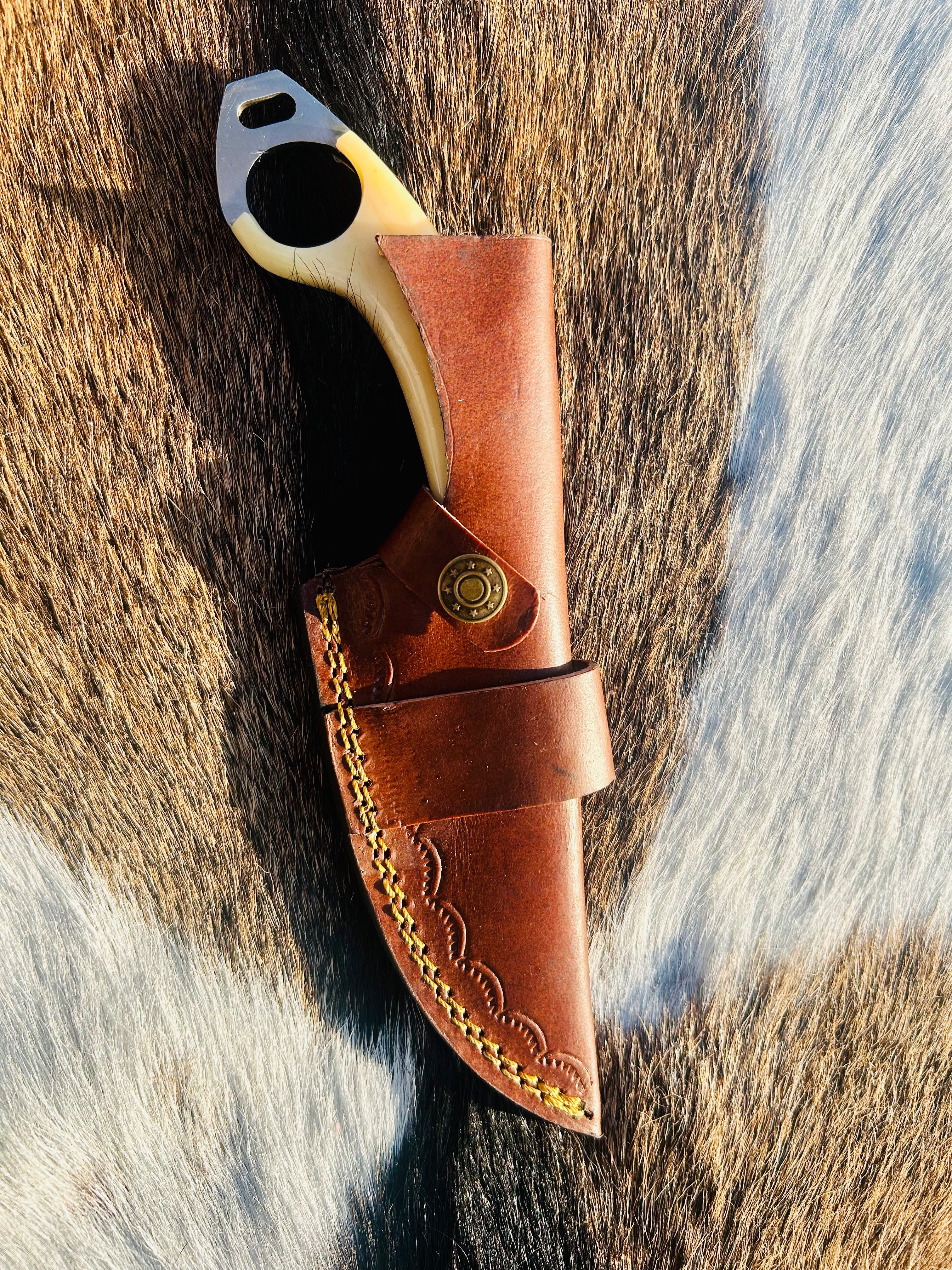 Bone handle with natural texture and steel pins visible