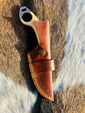 Bone handle with natural texture and steel pins visible