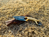 Bone handle and Damascus pattern in natural lighting