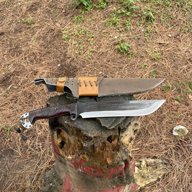 Outdoor kukri knife on log bushcraft and survival gear display