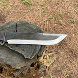 Knife with a black handle and silver blade on a wooden stump for camping and safety.