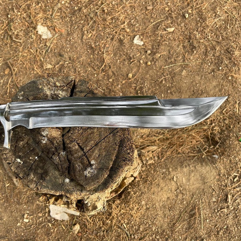 Long shining blade sword on a wooden block with a natural light in background forest for camping and protection