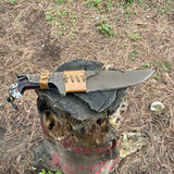 Gurkha Knife with a sheath on a wooden log showcase used in camping and adventure
