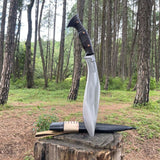 Knife with leather sheath on a wooden stump in a forest setting