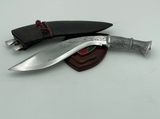 Historical Gurkha kukri knife with brass handle and pinewood-lined leather sheath