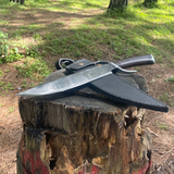 Hand-forged bowie khukuri knife displayed with sheath