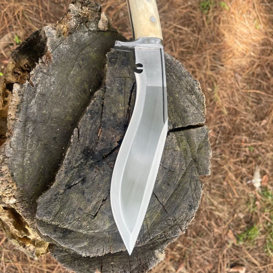 Side angle shot of 8‑inch Chukukri with full‑tang handle and polished spine