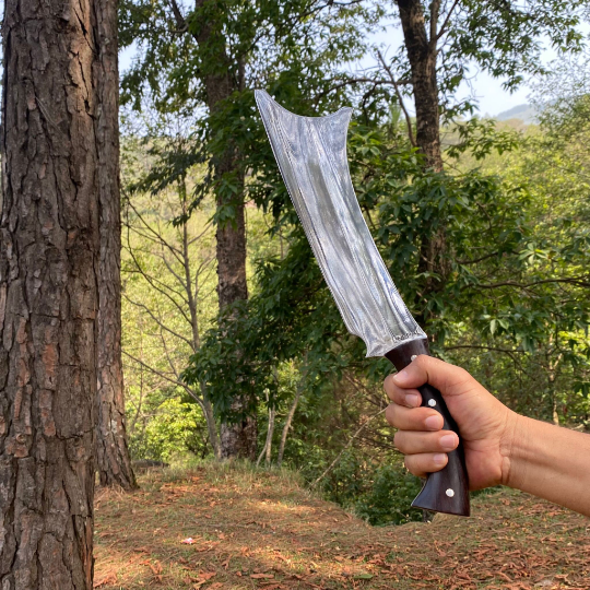 Man holding traditional handmade cleaver knife from Nepal