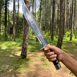 man holding 11 inch bowie knife