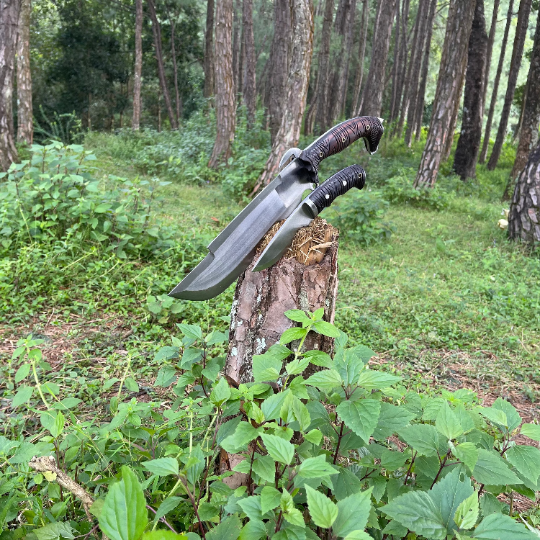 bajyu handmade machete and small machete stucked in wooden log used for easy and heavy task like camping, chopping woods.
