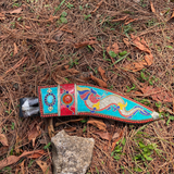 beautiful sheath with dragon design laying on grass in forest showcase