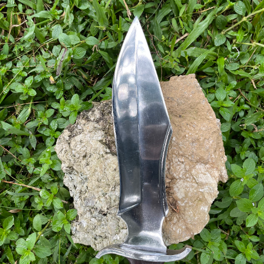 Hand-forged 5160 steel blade of 10-inch Tikau Kukri knife showing sharp edge and curved belly