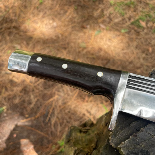 well textured shaped strong handle of bowie knife