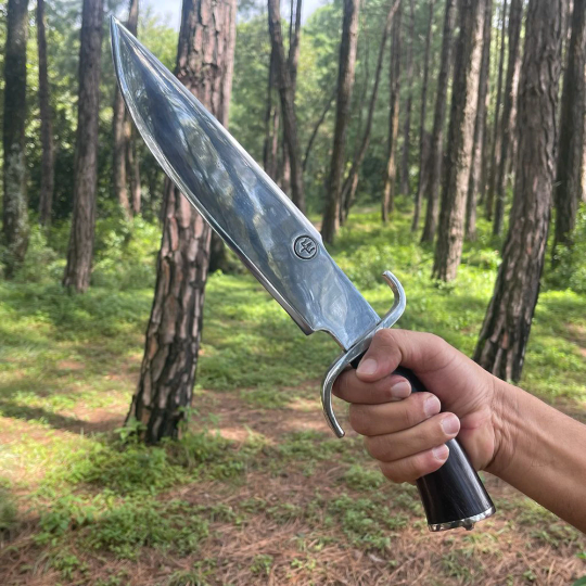 Man holding Authentic Nepalese khukuri with sharp curved blade