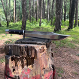11 inch bowie knife in wooden log
