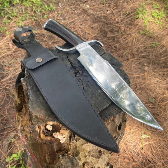 Hand-forged khukuri blade displayed with sheath