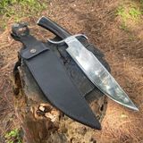 Hand-forged khukuri blade displayed with sheath