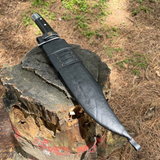 11 inch bowie knife inside black leather sheath for protection from rust