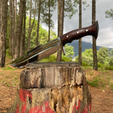 Knife with a wooden handle on a tree stump in a forest setting