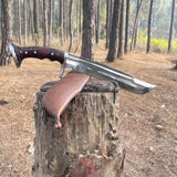 Knife with a wooden handle and brown leather sheath on a tree stump in a forest for camping and protection