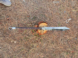 Sword on the ground with a natural background with perfect sharp blade and handle for nice grip