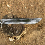 Long shining blade sword on a wooden block with a natural light in background forest for camping and protection