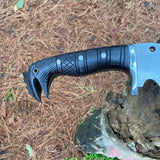 Close-up of a black-handled machete knife on a natural background