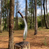 Salyani kukri stuck lightly in log for chopping demonstration stucked in wooden log
