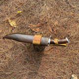 Close-up of differential tempered blade showing Seax-style edge and polished handle